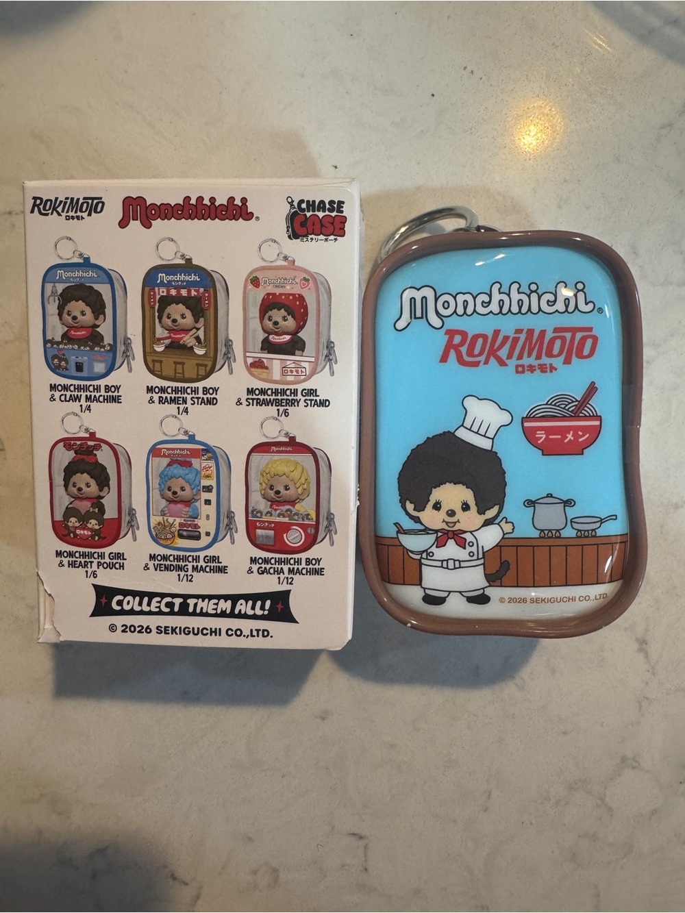 Monchhichi Ramen Shop Chase Case Keychain - Brown & Blue - Picture 2 of 2